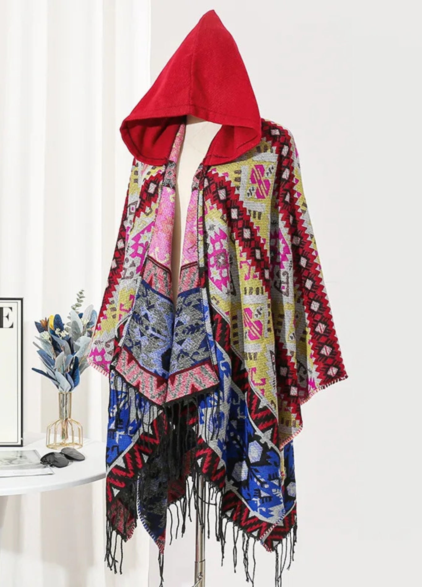 Colourful poncho with red hood | Bjorn