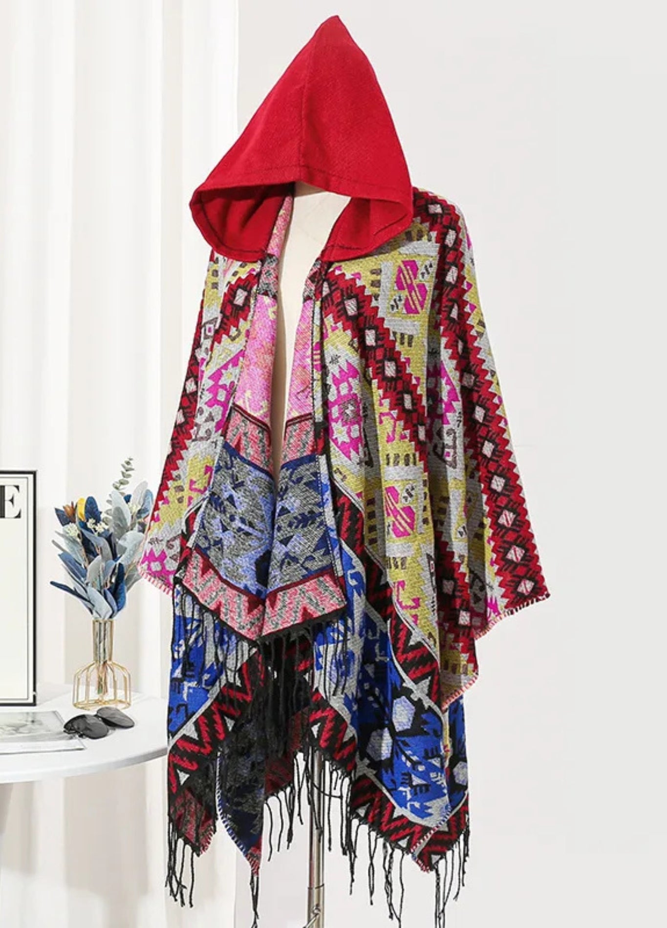 Colourful poncho with red hood | Bjorn