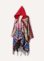 Colourful poncho with red hood | Bjorn