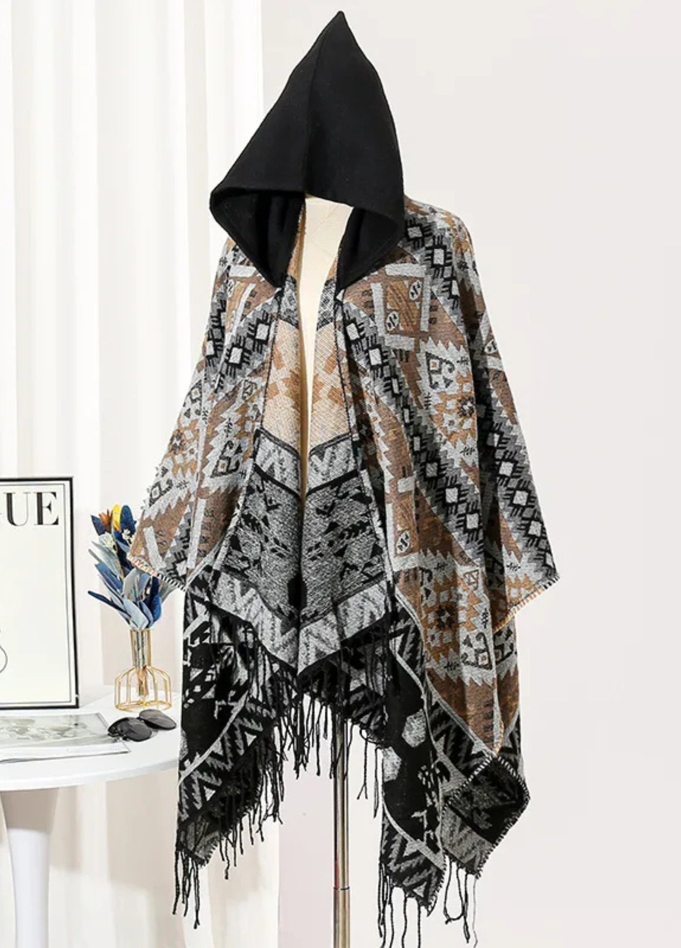 Geometric hooded poncho with tassel finish | Thorn