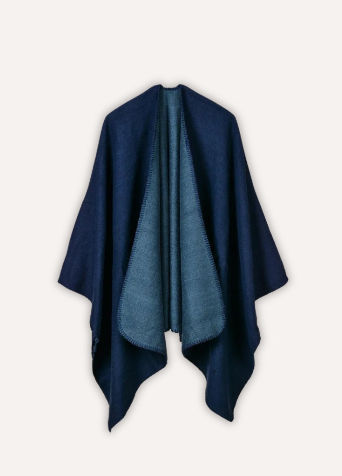 Women's blue poncho with contrast stitching